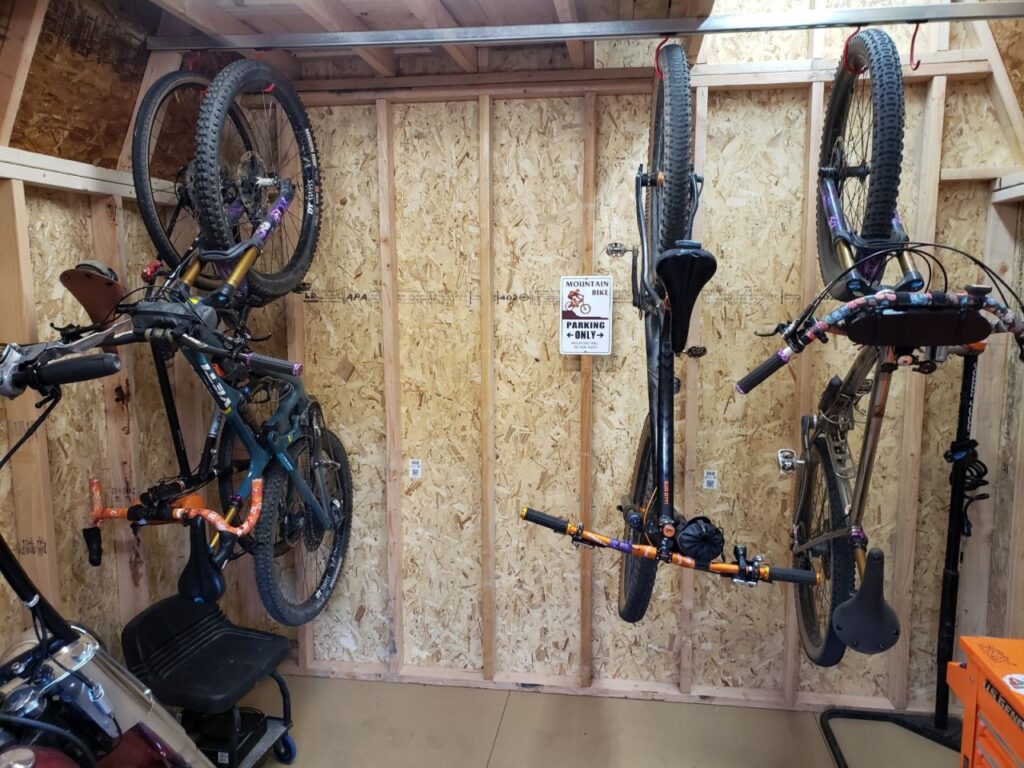 bikes hanging from sliding hooks pushed apart
