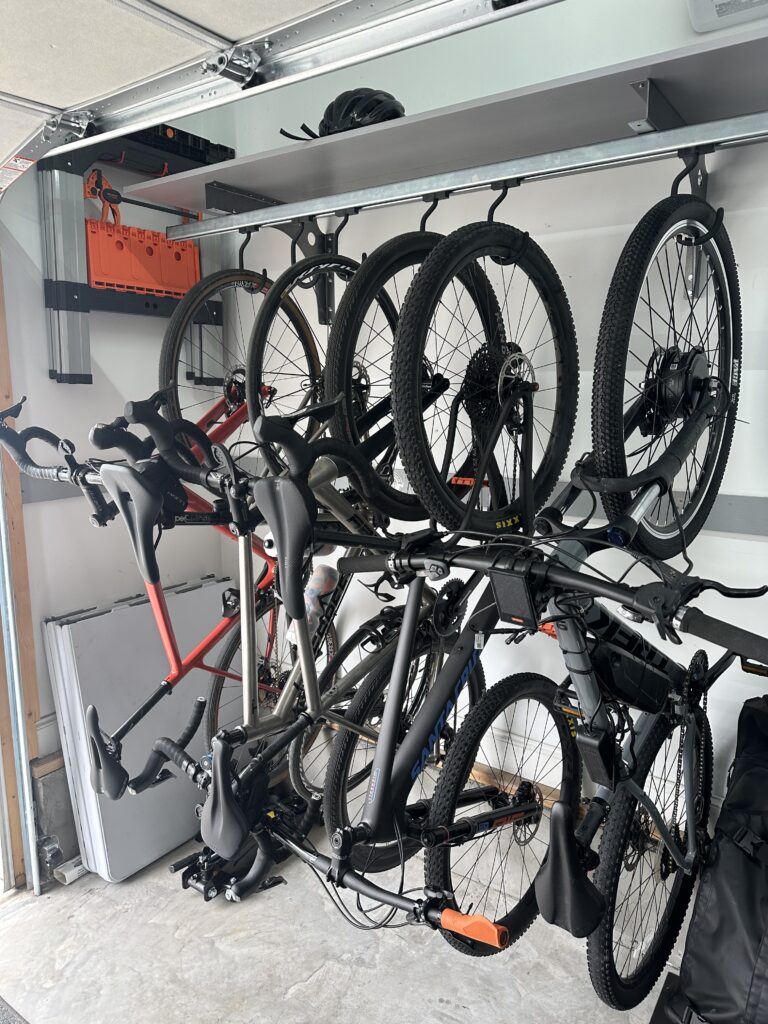 Five bikes under garage door rail.